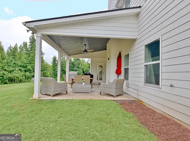 a front view of the house with yard and porch