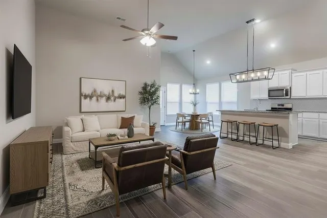 a living room with furniture and a flat screen tv