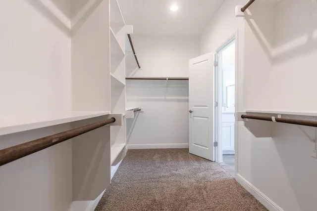 a bathroom with a tub a sink and a mirror