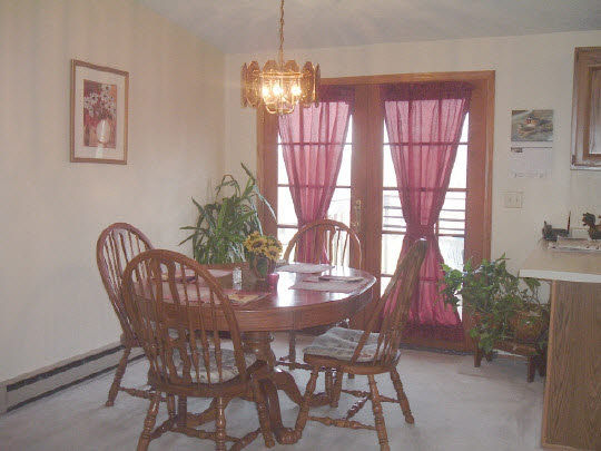 97 Newport Road Lake Summerset, IL 61019 - Photo 3 of 6 a view of a dining room with furniture window and outside view