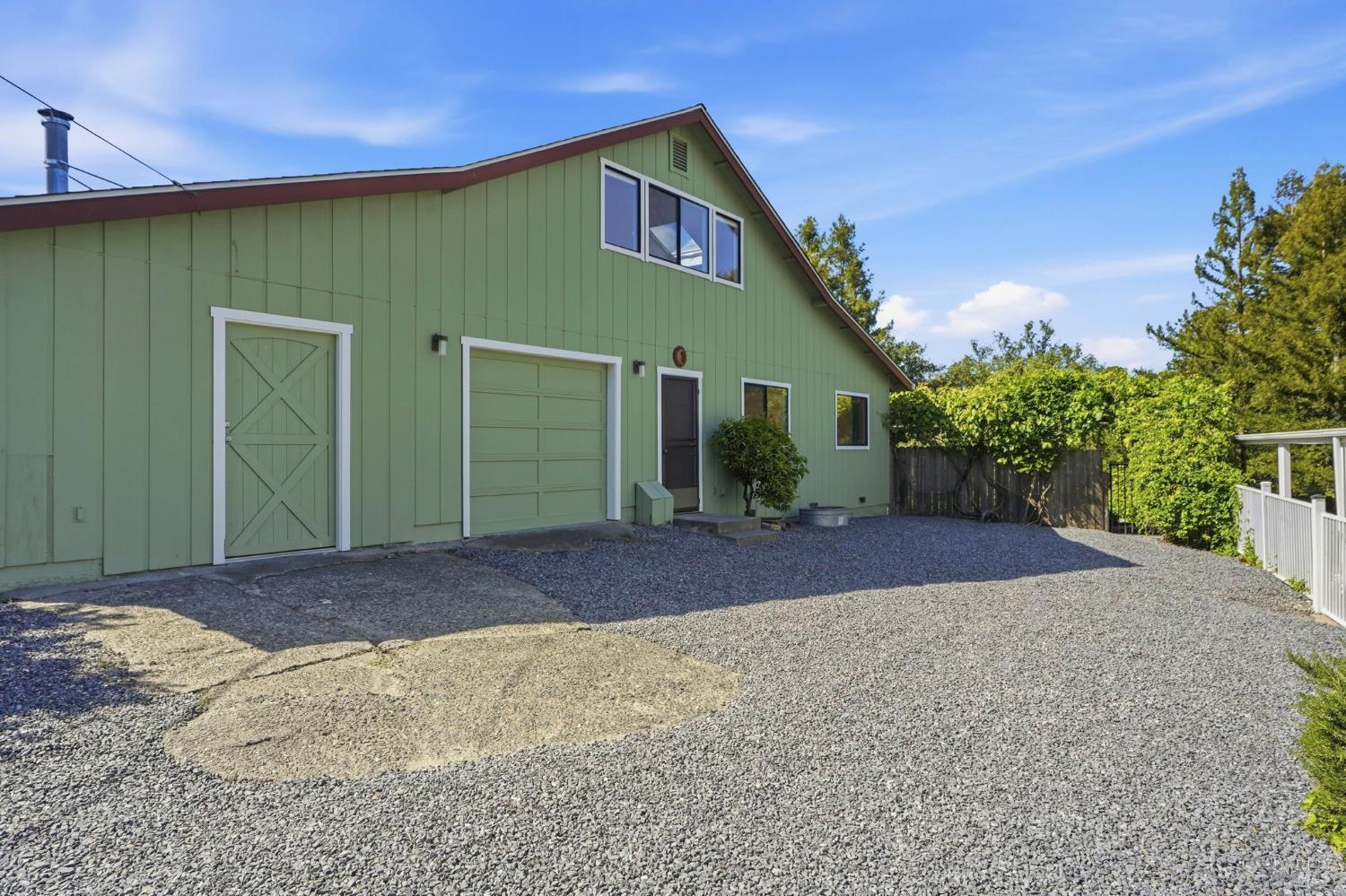 5851 Vine Hill Road Sebastopol, CA 95472 - Photo 57 of 71 Detached barn with shop, finished office space and upstairs apartment. Middle bay can easily be converted back to a garage space with garage door still intact.