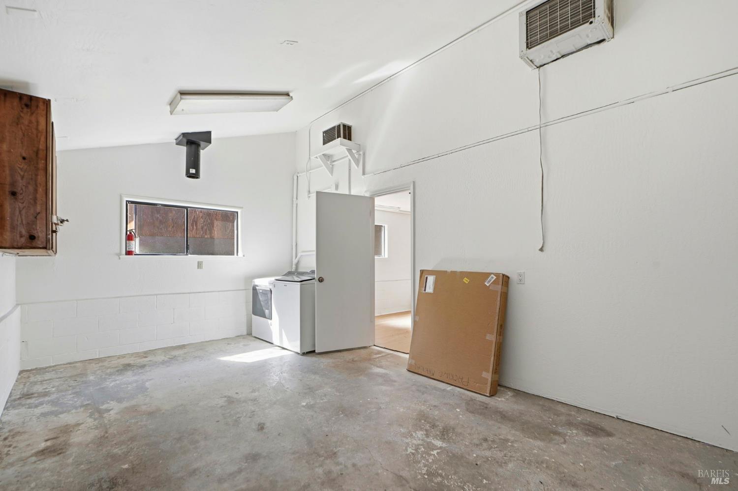 5851 Vine Hill Road Sebastopol, CA 95472 - Photo 68 of 71 Workshop area of the barn with washer and dryer.