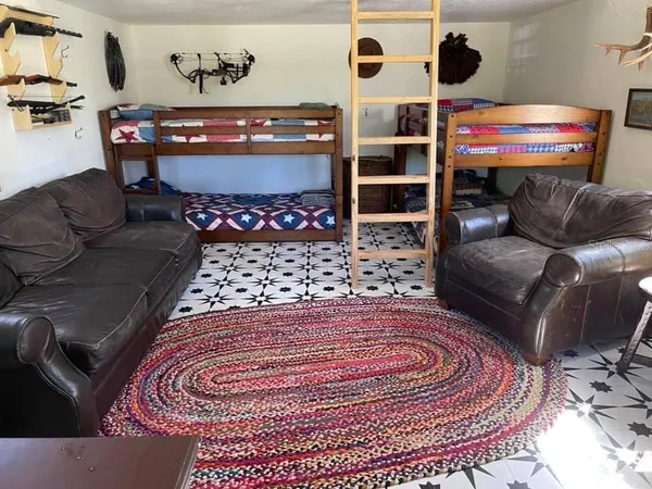 a room with furniture and a rug