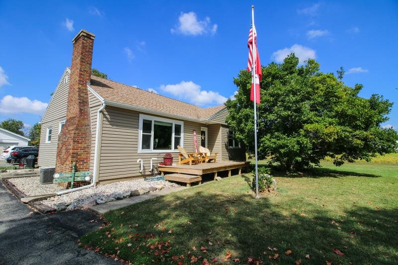 5123 River Road Cherry Valley, IL 61016 - Photo 1 of 15 a backyard of a house with table and chairs