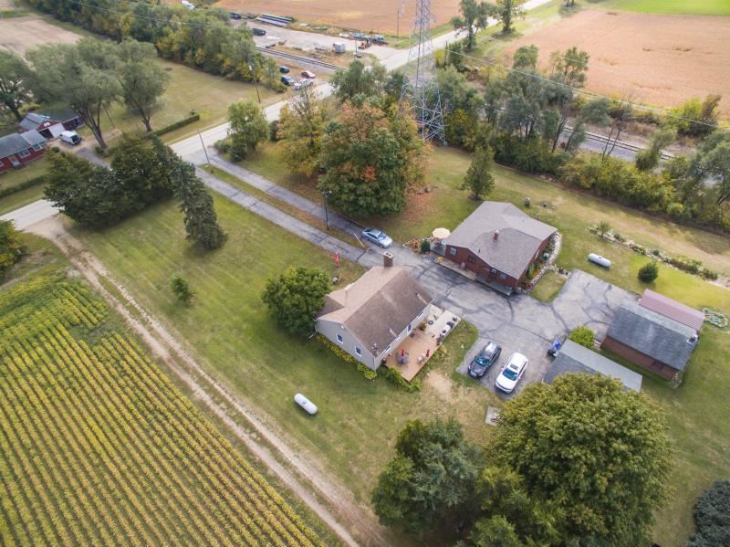 5123 River Road Cherry Valley, IL 61016 - Photo 12 of 15 an aerial view of a house with a lake view