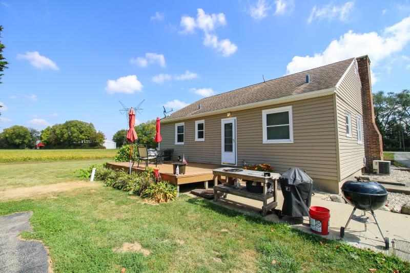 5123 River Road Cherry Valley, IL 61016 - Photo 10 of 15 a backyard of a house with yard table and chairs