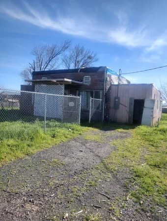 a house view with a backyard space