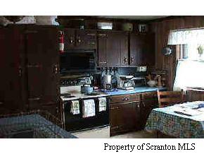 1273 Brookfield Road Lake Ariel, PA 18436 - Photo 2 of 3 a kitchen with a sink and cabinets