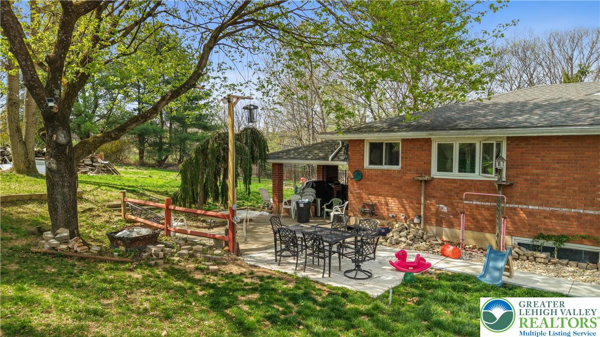 1042 Neffs Laurys Road Laurys Station, PA 18059 - Photo 3 of 27 a view of outdoor sitting area with trees