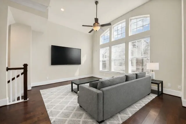 a bathroom with a sink a toilet a mirror and shower