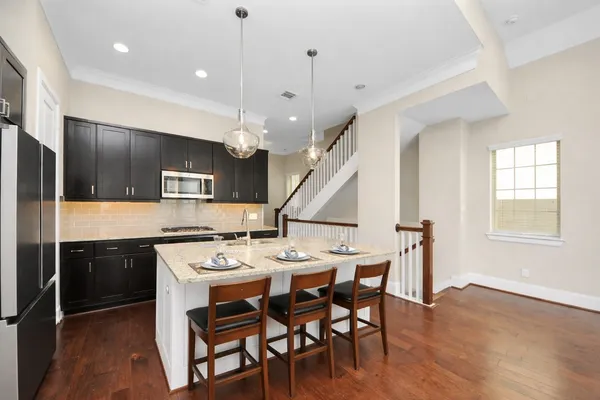 a kitchen with a stove and a sink