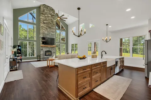 a kitchen with wooden cabinets and a stove top oven