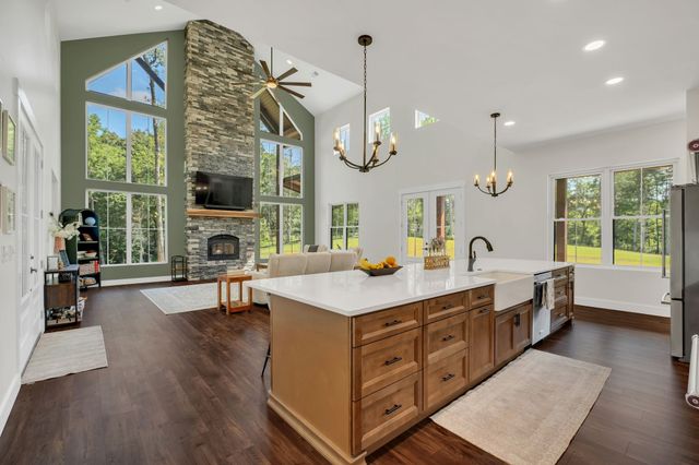 a kitchen with wooden cabinets and a stove top oven