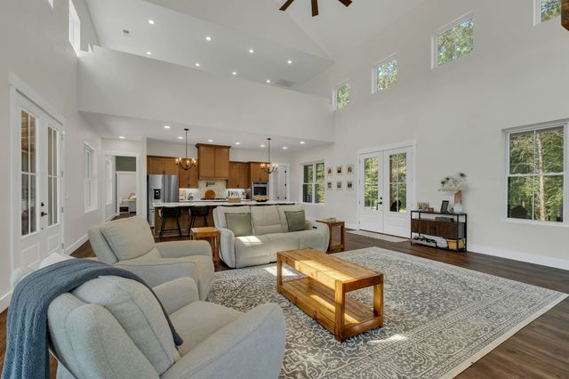 a kitchen with granite countertop a cabinets and steel stainless steel appliances