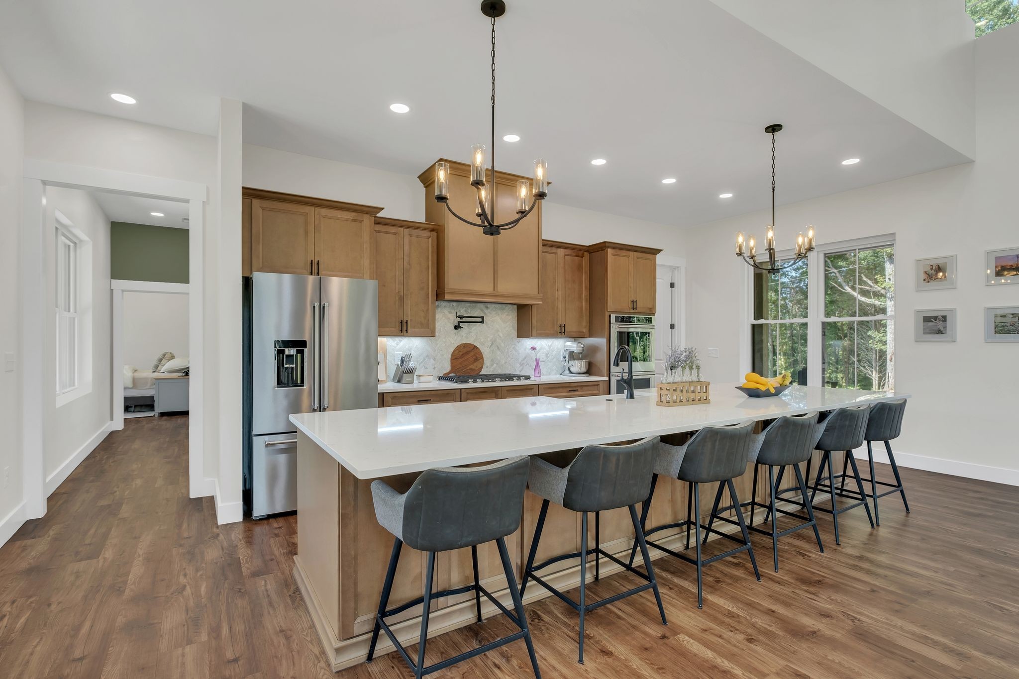 3573 Sandy Springs Road Cedar Hill, TN 37032 - Photo 19 of 87 a kitchen with stainless steel appliances a dining table chairs and wooden floor