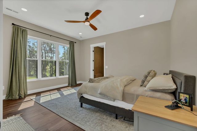 a bedroom with a bed and a closet