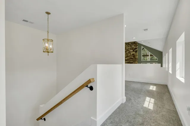 a kitchen with a sink and a stove top oven