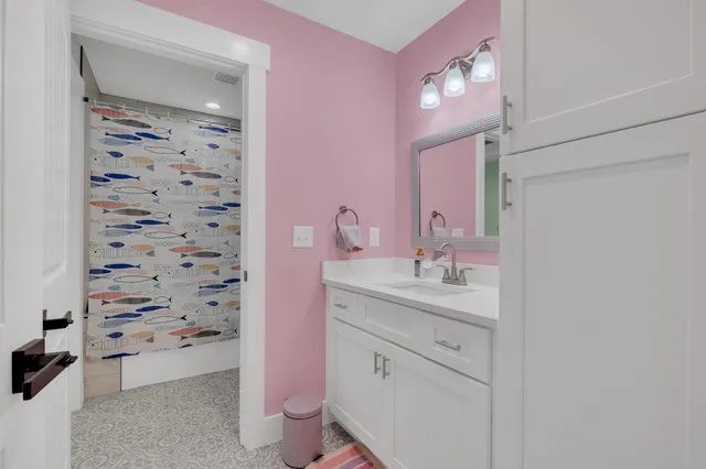 an aerial view of a house with a yard and lake view