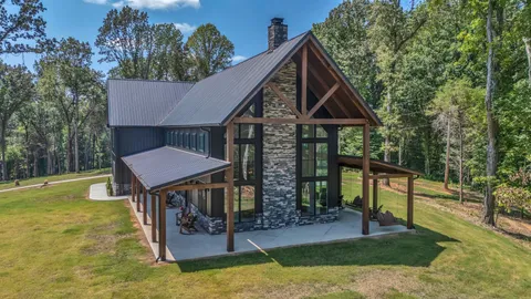 a living room with furniture fireplace and window