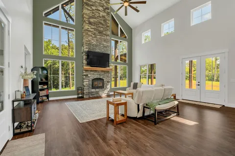 a living room with furniture and a fireplace
