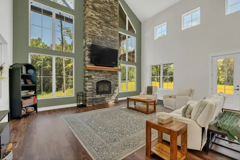 a living room with a flat screen tv and a fireplace