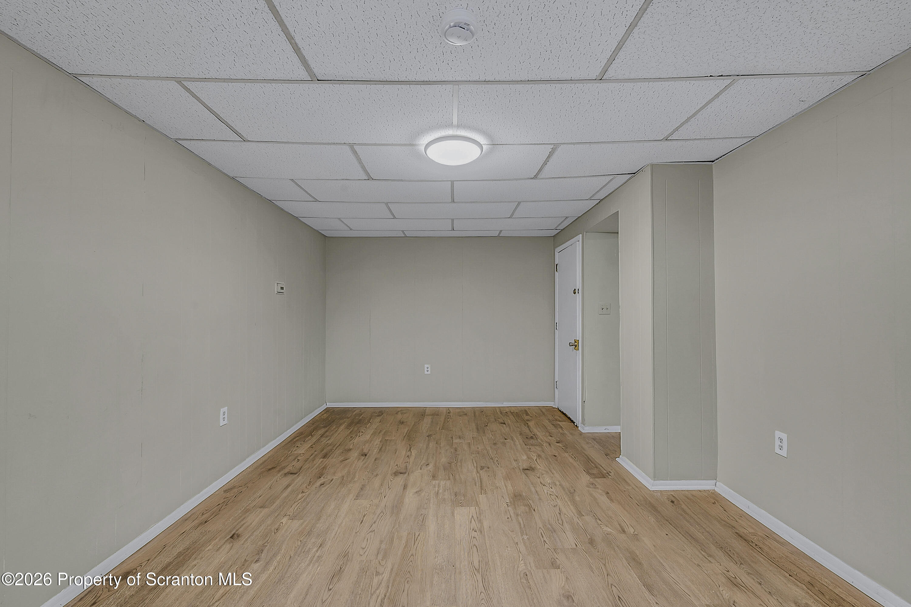 2513 North Main Avenue, Unit 2 Scranton, PA 18508 - Photo 7 of 19 a view of a room with wooden floor and white walls