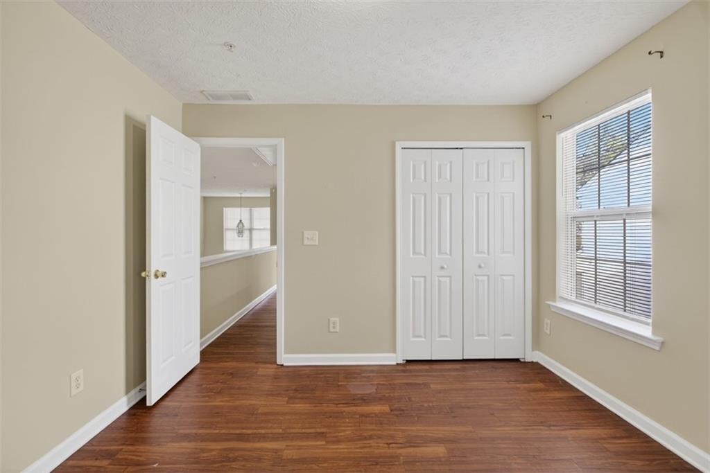 3159 Panthers Trace Decatur, GA 30034 - Photo 22 of 39 a view of an empty room with wooden floor and a window