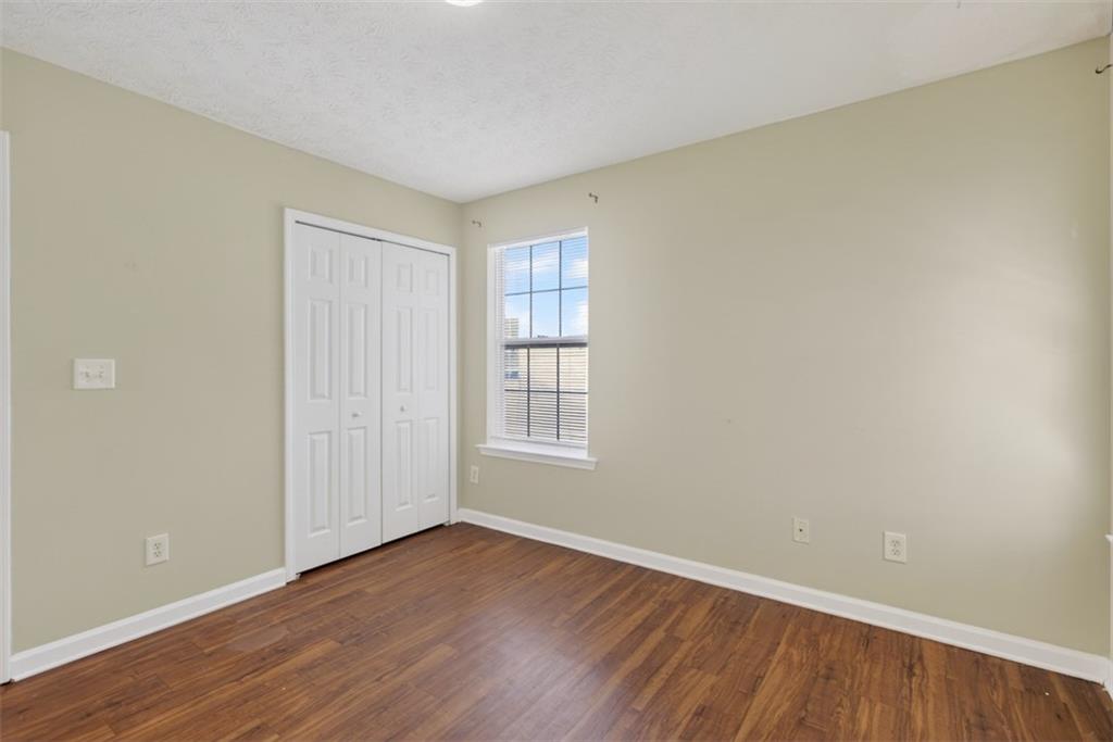 3159 Panthers Trace Decatur, GA 30034 - Photo 23 of 39 a view of an empty room with wooden floor and a window