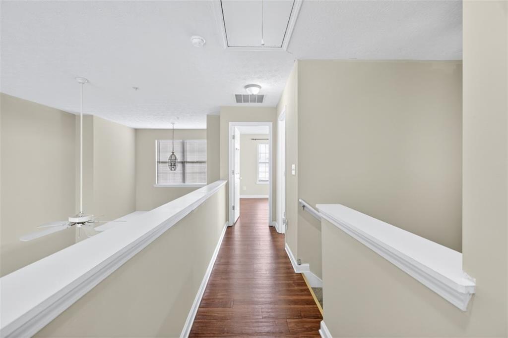 3159 Panthers Trace Decatur, GA 30034 - Photo 26 of 39 a view of a hallway with wooden floor and staircase