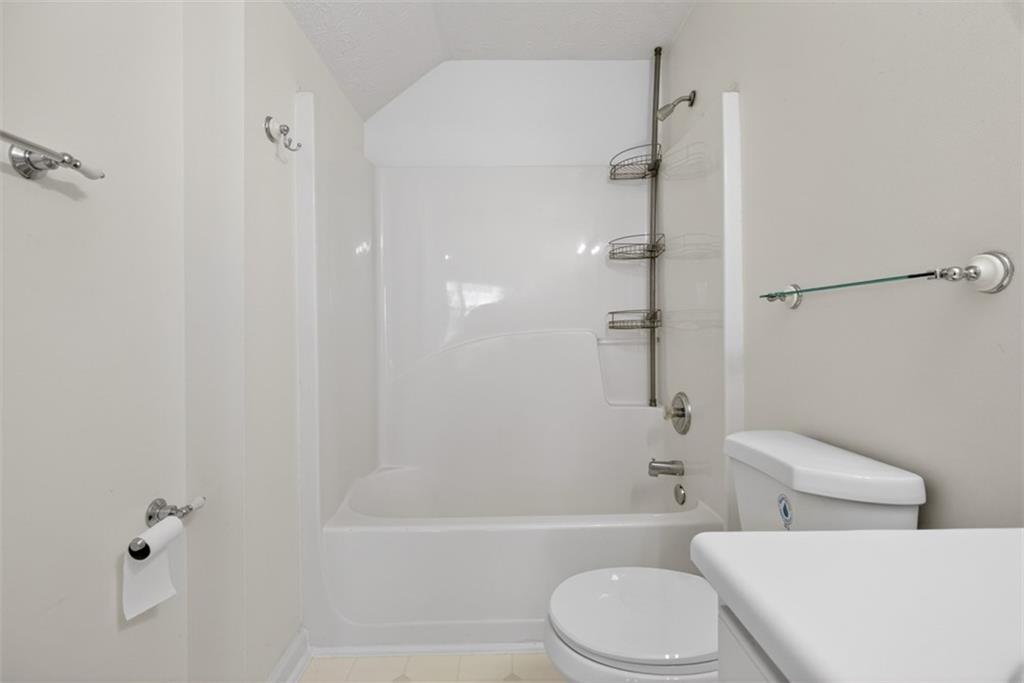 3159 Panthers Trace Decatur, GA 30034 - Photo 30 of 39 a white toilet and tub sitting next to a bathroom sink