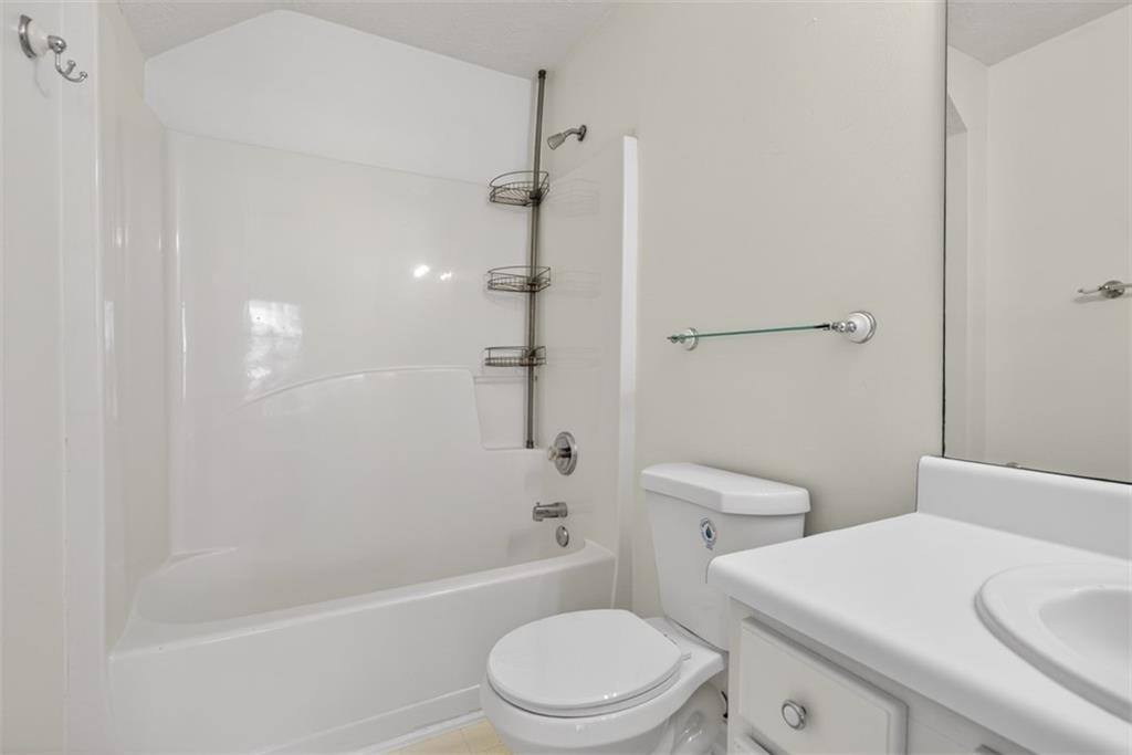 3159 Panthers Trace Decatur, GA 30034 - Photo 31 of 39 a white toilet sitting next to a bath tub