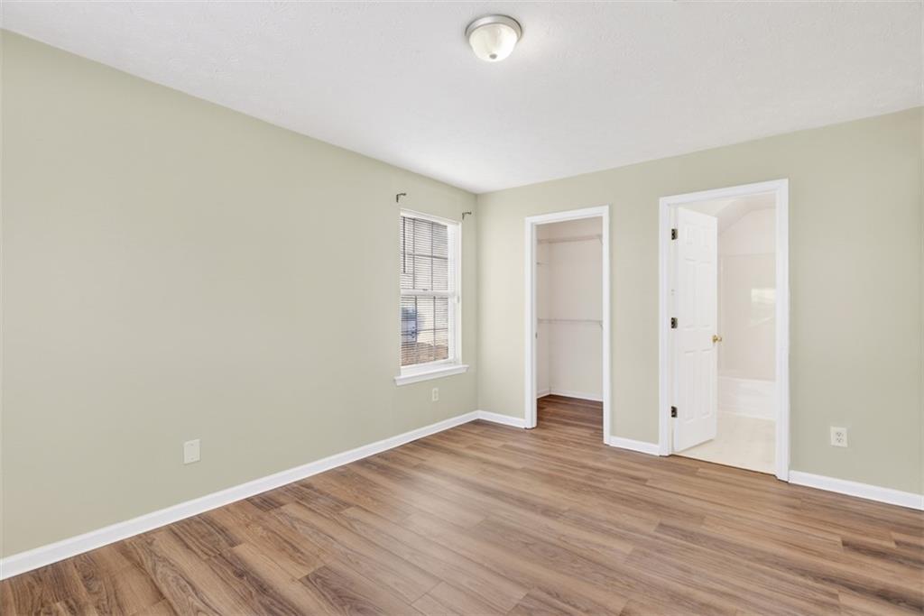 3159 Panthers Trace Decatur, GA 30034 - Photo 33 of 39 an empty room with wooden floor and windows