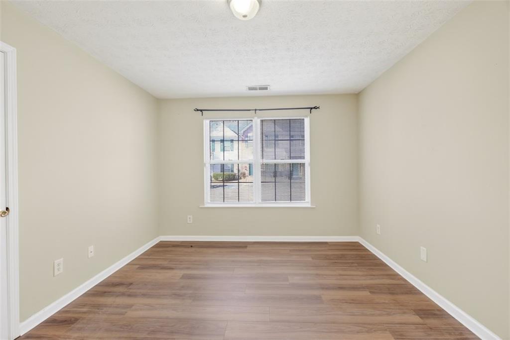 3159 Panthers Trace Decatur, GA 30034 - Photo 35 of 39 an empty room with wooden floor and windows