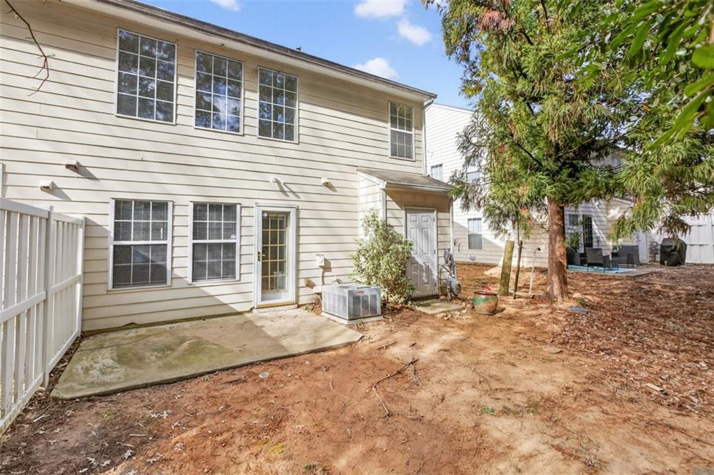 3159 Panthers Trace Decatur, GA 30034 - Photo 36 of 39 a front view of a house with a yard and potted plants