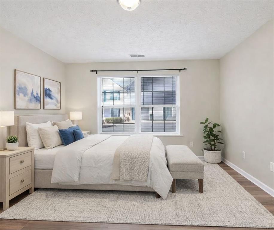 3159 Panthers Trace Decatur, GA 30034 - Photo 5 of 39 a bedroom with a large bed and a couch