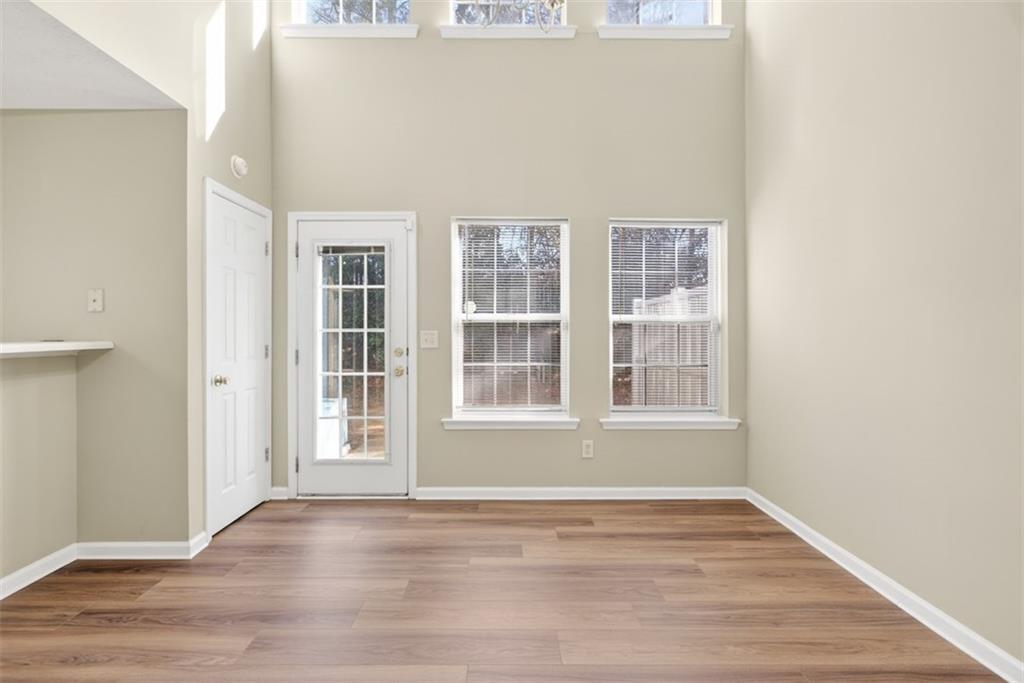 3159 Panthers Trace Decatur, GA 30034 - Photo 10 of 39 an empty room with wooden floor and windows