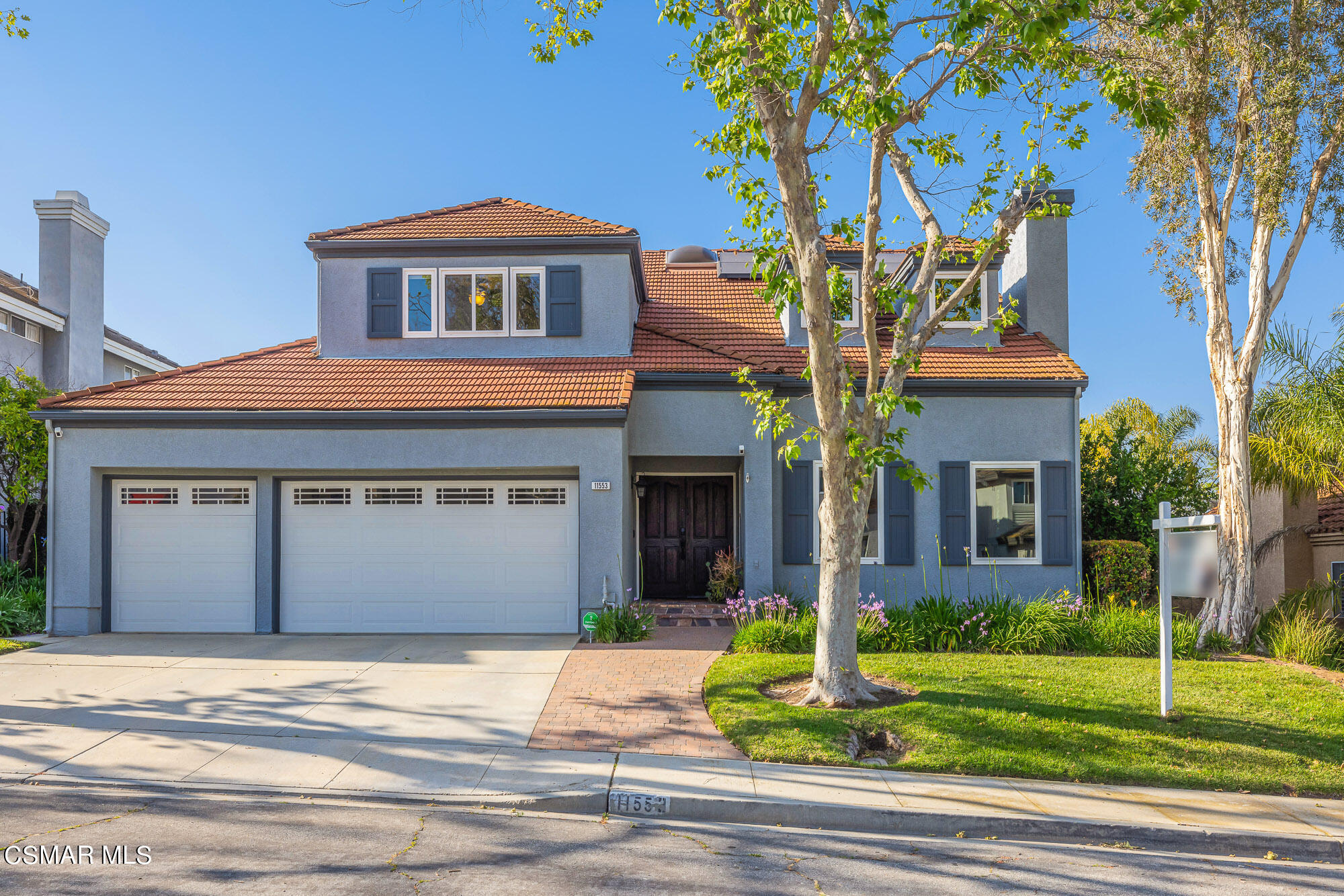 11553 Chestnut Ridge Street Moorpark, CA 93021 - Photo 2 of 68 a front view of a house with garden