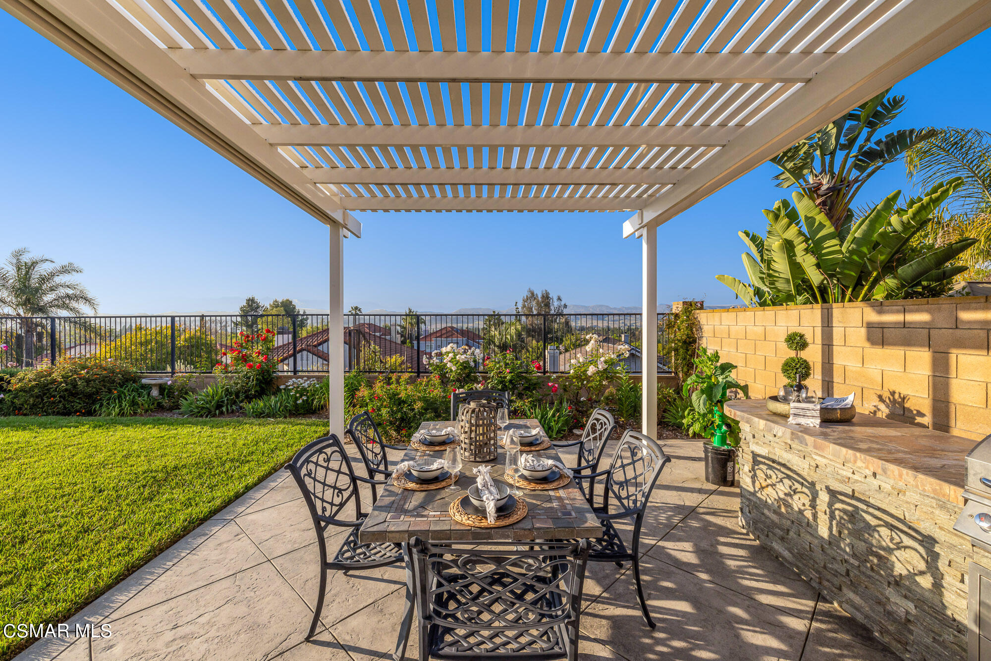 11553 Chestnut Ridge Street Moorpark, CA 93021 - Photo 54 of 68 a view of a patio with table and chairs and potted plants