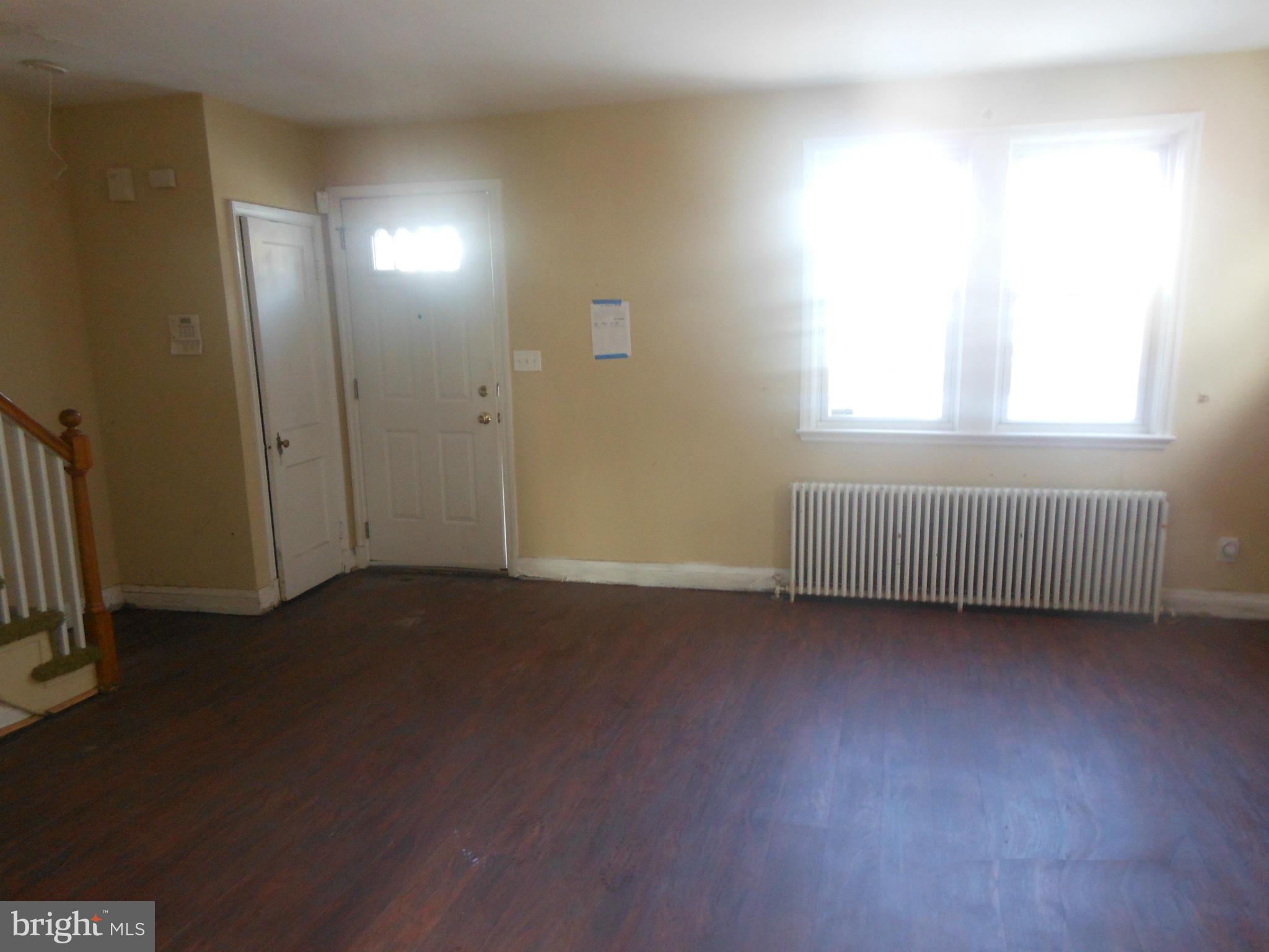 516 Charing Cross Road Baltimore, MD 21229 - Photo 3 of 9 an empty room with a window
