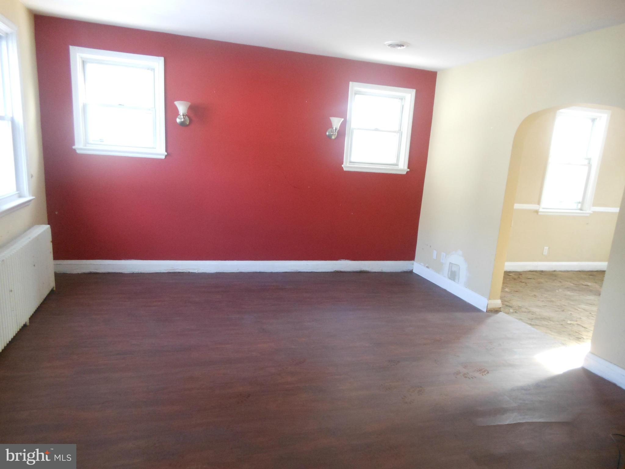 516 Charing Cross Road Baltimore, MD 21229 - Photo 4 of 9 an empty room with windows