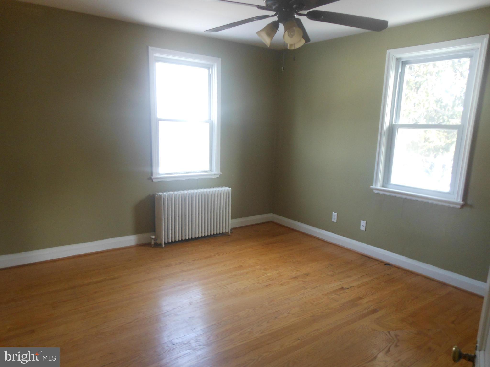 516 Charing Cross Road Baltimore, MD 21229 - Photo 7 of 9 a view of an empty room with a window