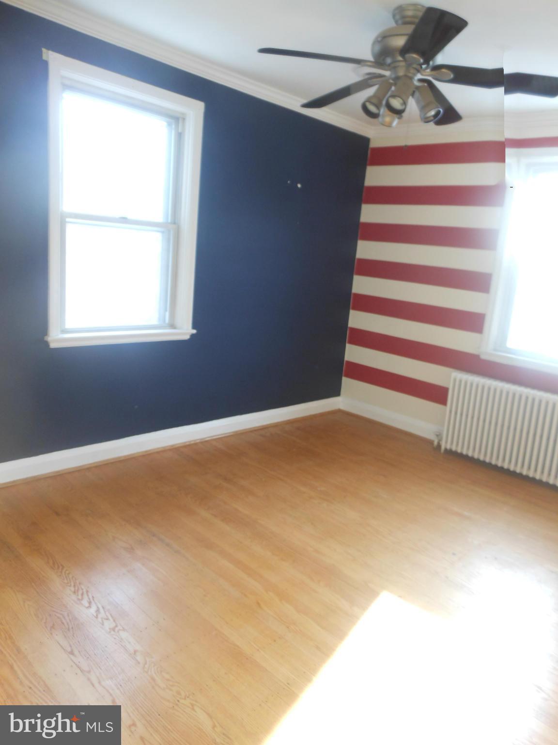 516 Charing Cross Road Baltimore, MD 21229 - Photo 8 of 9 a view of an empty room with a window