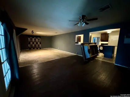 a view of livingroom with furniture and chandelier fan