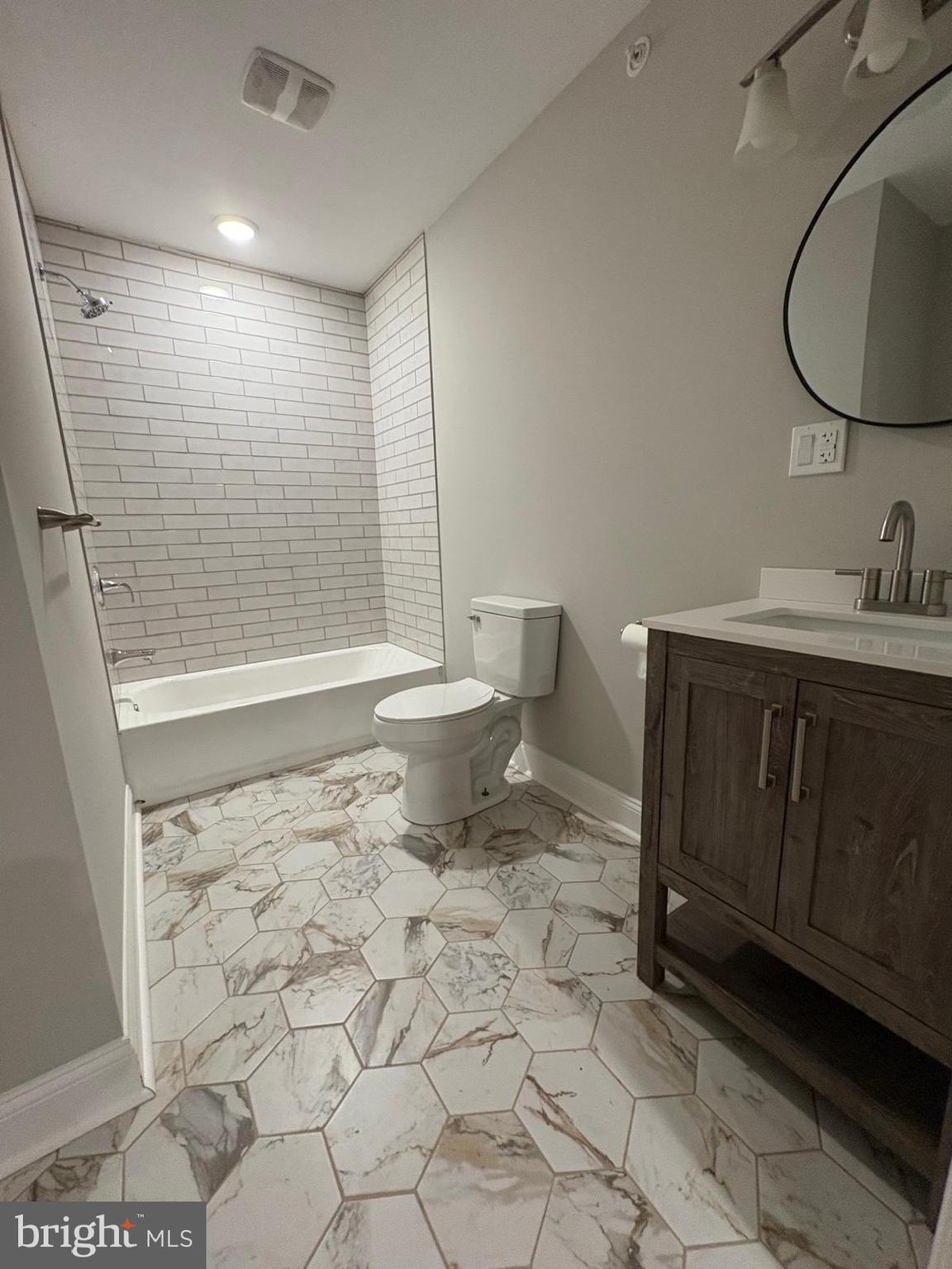 2900 North 5th Street, Unit 1 Philadelphia, PA 19133 - Photo 9 of 9 a bathroom with a toilet a sink and shower