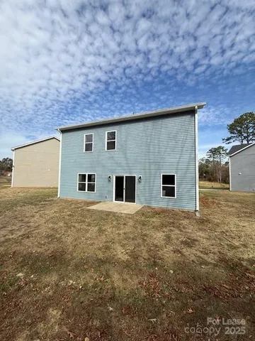 a kitchen with a stove a sink and a refrigerator