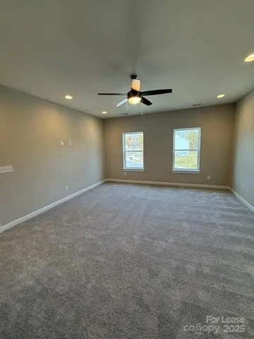 a spacious bathroom with a double vanity sink and a mirror