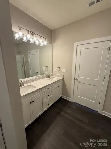 an empty room with a empty space and windows