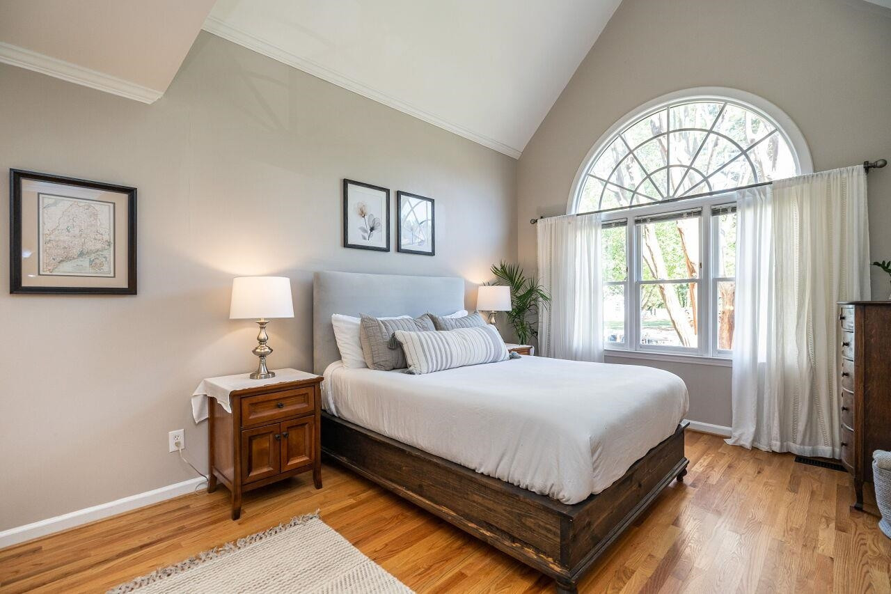 5905 Stable Court Raleigh, NC 27612 - Photo 15 of 30 a bedroom with a bed and a window