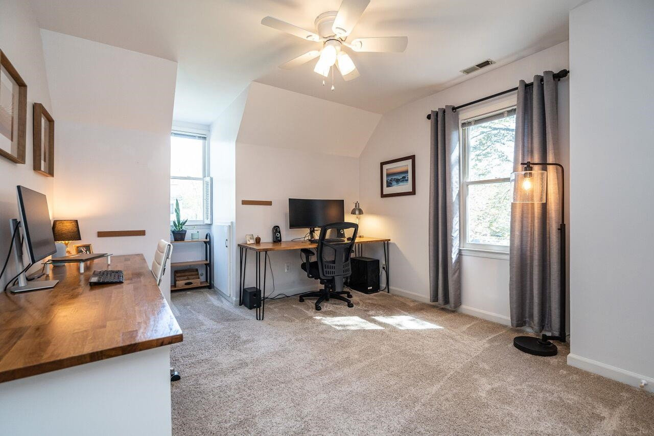 5905 Stable Court Raleigh, NC 27612 - Photo 20 of 30 a view of a livingroom with workspace and a window