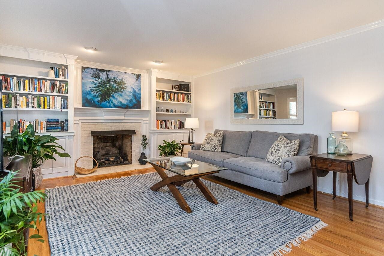 5905 Stable Court Raleigh, NC 27612 - Photo 2 of 30 a living room with furniture and a fireplace